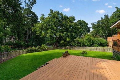 Tucked into a private wooded lot with a stunning lake view in - photo 49