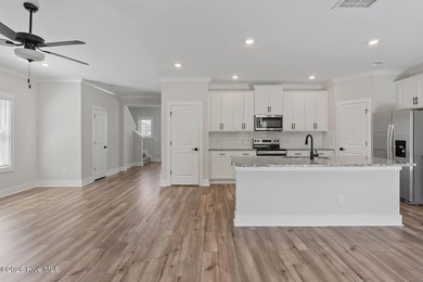 The Camden is a thoughtfully designed two-story home featuring - photo 4
