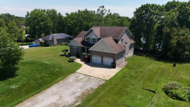 Welcome to this stunning two-story waterfront home in the highly - photo 2