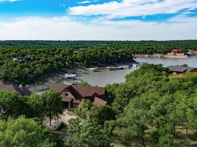 Stunning custom waterfront home on Lake Bridgeport. This 1 acre - Lake Home For Sale in Chico, Texas