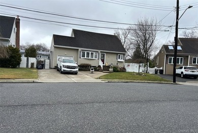 Cape style home. This home features 4 bedrooms, 2 full baths, an - photo 1