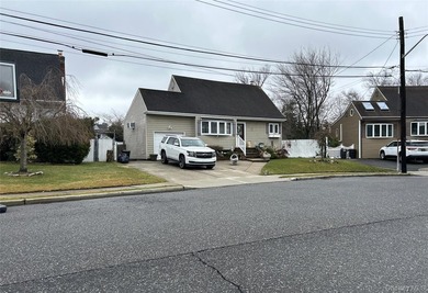 Cape style home. This home features 4 bedrooms, 2 full baths, an - photo 2