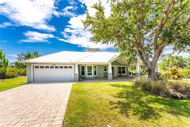 Welcome to this distinctive Key West-style home located in the - photo 33