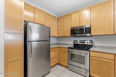 Perched on the top floor as a desirable corner end unit, this 3 - photo 4