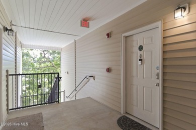 Perched on the top floor as a desirable corner end unit, this 3 - photo 8