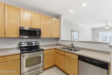 Perched on the top floor as a desirable corner end unit, this 3 - photo 10
