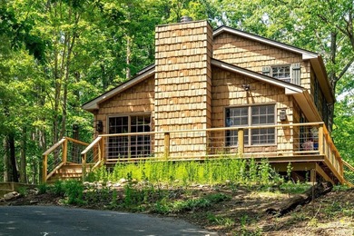 Nestled in the heart of Massanutten, this charming cabin offers - photo 1