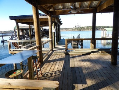 A refined waterfront retreat showcasing custom materials - photo 16