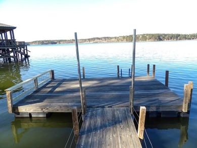 A refined waterfront retreat showcasing custom materials - photo 22
