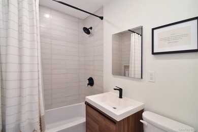 Triple-Mint High-Floor Corner Condo with Balcony, Water Views & - photo 13