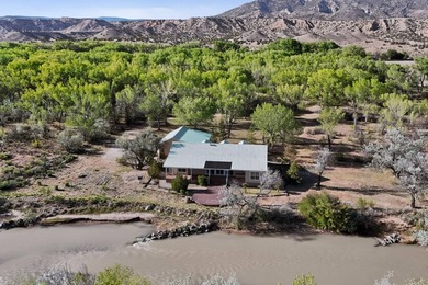 A short driveway, down a quiet dirt road, leads you through a - photo 3