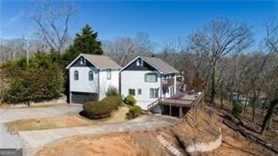 Lake Home For Sale in Flowery Branch, Georgia
