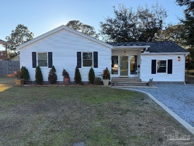 This well-kept 4-bedroom, 2-bath home, has a warm cottage - photo 3