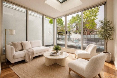 Welcome to Residence 1B, a bright and expansive duplex offering - photo 1