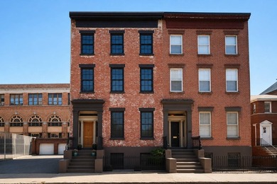 This exceptional 25-foot-wide single-family brownstone sits in - photo 1