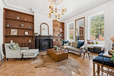 This exceptional 25-foot-wide single-family brownstone sits in - photo 2