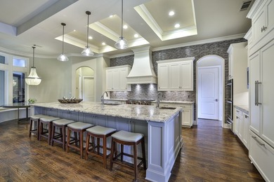 Exceptional French-inspired home with a modern flair, located in - photo 11
