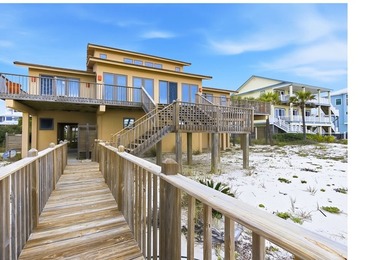 Located within a highly desirable gated coastal community, this