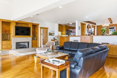 Located within a highly desirable gated coastal community, this