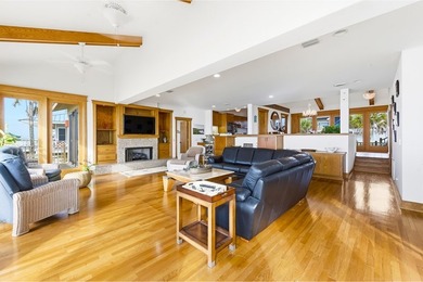 Located within a highly desirable gated coastal community, this