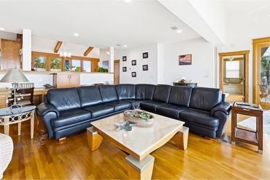 Located within a highly desirable gated coastal community, this