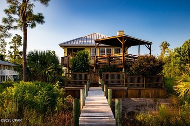Custom-built in 2004 on 9' pilings with 4' of fill, this 2,172 - photo 4