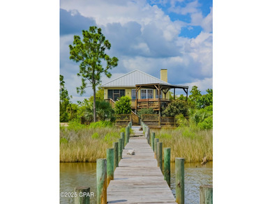 Custom-built in 2004 on 9' pilings with 4' of fill, this 2,172 - photo 6