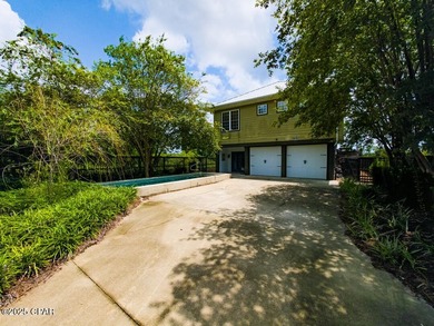 Custom-built in 2004 on 9' pilings with 4' of fill, this 2,172 - photo 7