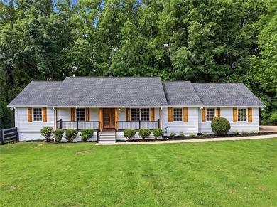 Fully renovated ranch home on a fenced private acre in one of - photo 1