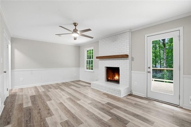 Fully renovated ranch home on a fenced private acre in one of - photo 3