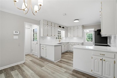 Fully renovated ranch home on a fenced private acre in one of - photo 4
