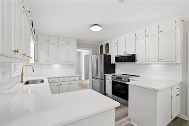 Fully renovated ranch home on a fenced private acre in one of - photo 6