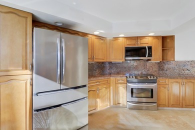 Look No Further! Rarely available 3BR/2BA top-floor end unit in