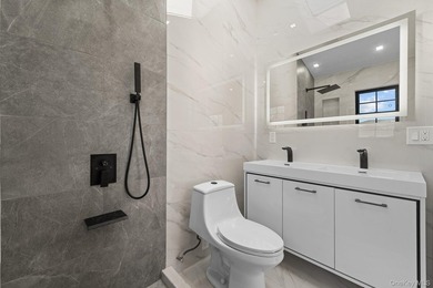 241-49-148th Drive is a meticulously renovated two family tucked - photo 12