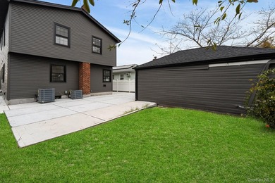 241-49-148th Drive is a meticulously renovated two family tucked - photo 15