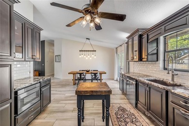 Welcome to a beautifully updated home located within the gated - photo 22