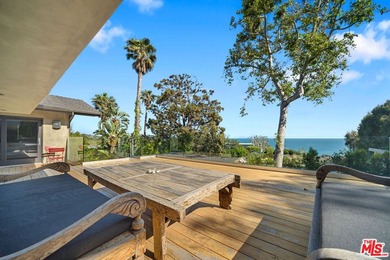 Set on a bluff above Broad Beach, this Balinese-inspired - photo 16