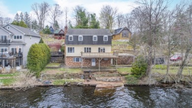 Enjoy Breathtaking Views At This Lakefront Home On Upper - Lake Home For Sale in West Milford, New Jersey