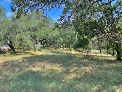 Located in Horseshoe Bay West, this level lot offers an easy - photo 1