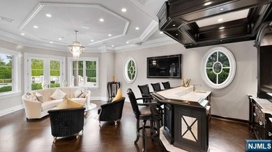 Welcome to this custom-built estate situated high atop the - photo 12
