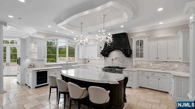 Welcome to this custom-built estate situated high atop the - photo 17