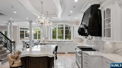 Welcome to this custom-built estate situated high atop the - photo 18