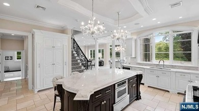 Welcome to this custom-built estate situated high atop the - photo 19