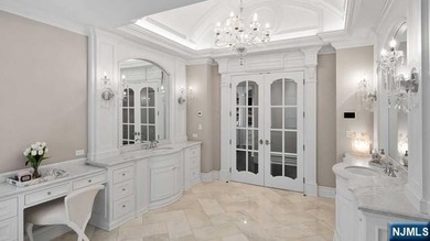 Welcome to this custom-built estate situated high atop the - photo 29