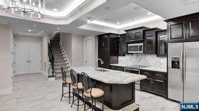 Welcome to this custom-built estate situated high atop the - photo 37