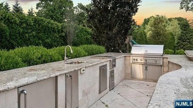 Welcome to this custom-built estate situated high atop the - photo 43