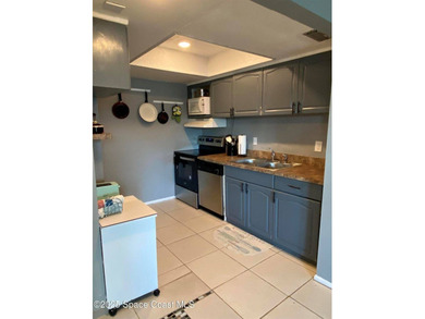 This charming top floor end unit overlooking the sparkling pool - photo 6