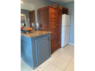This charming top floor end unit overlooking the sparkling pool - photo 7