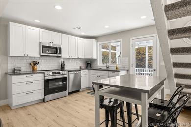 This stunning reverse 2-story lakefront home on MM 3 in Eldon - photo 26