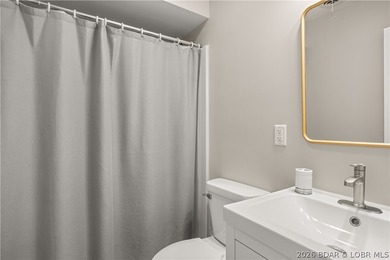 This stunning reverse 2-story lakefront home on MM 3 in Eldon - photo 34